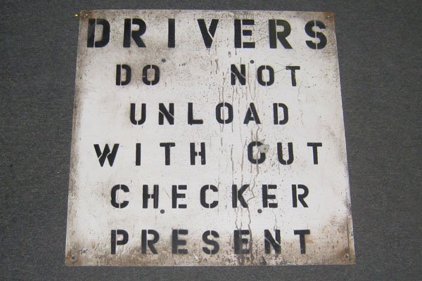 Sign-Drivers Do Not Unload Without Checker Present, stock number S-0760