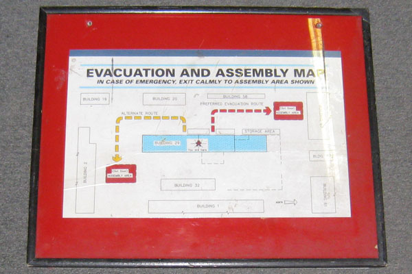 Sign-framed map-Evacuation And Assembly Map In Case Of Emergency Exit Calmly To, stock number S-0970