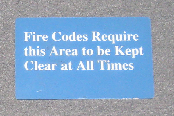 Sign-Fire Codes Require this area to be Kept Clear at All Times, stock number S-2071
