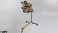 Engine, automobile, 4 cylinder, Toyota, on grey stand, T-shaped base, stock number E-0251b