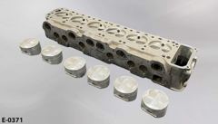 Engine block piece, 27"w x 7"d x 5"t, w/ 6 piston caps, 3¼" diam, stock number E-0371