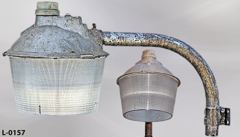 Light, street lamp, wall mount, w/ plastic round shade, stepdown, and, stock number L-0157