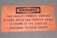 Sign-Warning this facility permits smoking in some areas, stock number S-0147