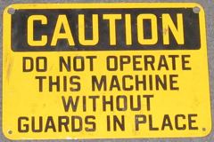 Sign-Caution do not operate this machine without guards in place, stock number S-0170