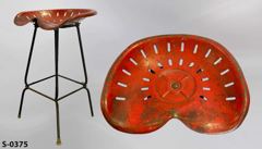 Stool, metal, 18"wx14"d red tractor seat on black legs. 25"t, stock number S-0375