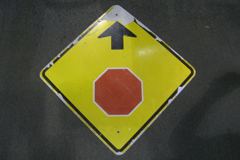 Sign-symbol of stop sign & arrow, metal, black/red/yellow, 30x30, stock number S-0403