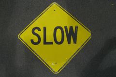 Sign-Slow, metal, black/yellow, 24x24, stock number S-0561