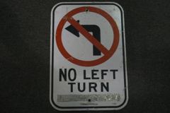 Sign-No Left Turn - w/ international symbol for no left turn, metal, stock number S-0605
