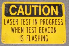 Sign-Caution Laser Test In Progress When Test Beacon Is Flashing, stock number S-0708