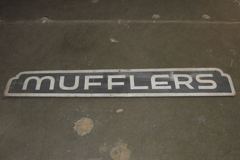 Sign-Mufflers, odd-shaped, hand painted wood, wht/blk, 58"w x 9"t, stock number S-0768