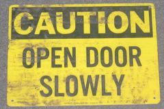 Sign-Caution Open Door Slowly, blk/ylw, plastic, 14"w x 10"t, stock number S-0783