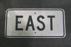 Sign-East, wht/black, metal, black/white, 24"w x 12"t, stock number S-0829