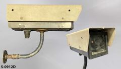 Security Camera, small w/ plexiglass front mounted on pipe elbow and, stock number S-0912d