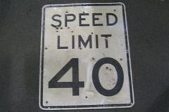 Sign-Speed Limit 40 - has bullet holes - metal, blk/wht, 24"w x 30"t, stock number S-1031