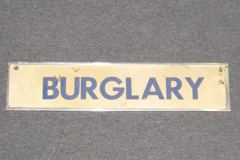 Sign-Burglary, cardboard in metal frame, blue/white, 18"w x 4"t, stock number S-1094