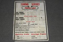 Sign-Towing Service Price List, w/ types of services listed and, stock number S-1134