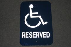 Sign-Reserved, w/symbol of person in wheelchair, metal, wht/blue 18x12, stock number S-1255