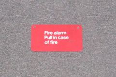 Sign-Fire Alarm Pull In Case Of Fire, red, plastic 5" x 3", stock number S-1309