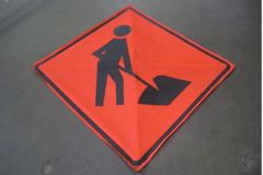 Sign-*SYMBOL* Man Working, fabric material, w/ "X" frame & mounting, stock number S-1431