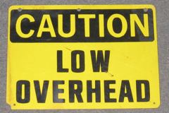 Sign-Caution Low Overhead, yellow, w/blk letters ( PLASTIC)., stock number S-1498