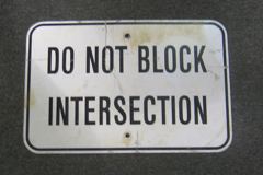 Sign-Do Not Block Intersection, blk/wht 12x18 metal, stock number S-1626