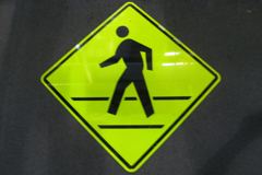Sign-crosswalk , black figure on neon yellow/green background , 41"w, stock number S-1789