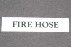 Sign-Fire Hose, lucite, white/green, 4" x 18", stock number S-1807