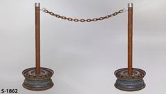 Stanchion, rusty pole w/ 15"diam. wheel rim base, 37"t, stock number S-1862