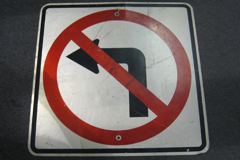 Sign-No Left Turn (symbol) red/wht/black, metal, 30"x30", stock number S-1916