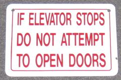 Sign-If Elevator Stops Do Not Attempt To Open Doors - plastic, stock number S-1996