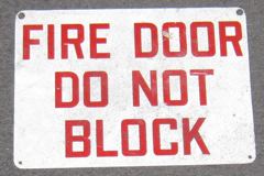 Sign-Fire Door Do Not Block, metal, wht/red, 14"w x10"t, stock number S-2010