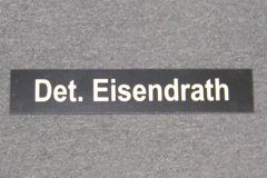 Sign-Det. Eisendrath, plastic, black, 13"w x 3"t, stock number S-2044a