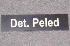 Sign-Det. Peled, plastic, black, 9 ½"w x 2 ½"t, stock number S-2044c