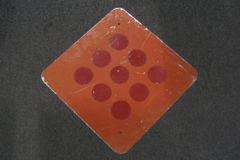 Sign-all red with 9 reflective circles, 18"w x 18"t, stock number S-2055