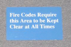 Sign-Fire Codes Require this area to be Kept Clear at All Times, stock number S-2071