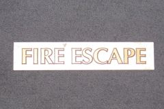 Sign-Fire Escape , beige/gold, plastic, 15"w x 3"t, stock number S-2221