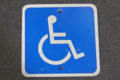 Sign-(handicapped symbol), blu/wht metal, 9"x9", stock number S-2318