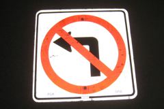 Sign-International symbol for no left turn, white/black/red, 24"w x, stock number S-2322