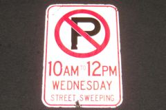 Sign-International symbol for no parking "10AM to 12PM Wednesday, stock number S-2324
