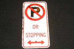 Sign-International symbol for no parking "Or Stopping" <, stock number S-2330