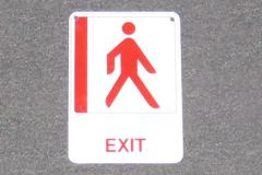 Sign-Exit w/ international symbol, white/red, plastic, 5"w x 7"t, stock number S-2369