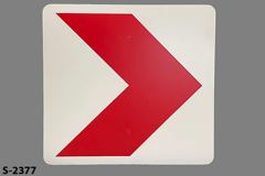Sign-Chevron, > red arrow on white background, plastic, 58" x 58", stock number S-2377