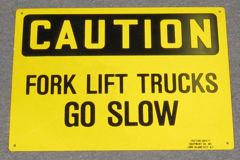 Sign-Caution Fork Lift Trucks Go Slow, plastic, ylw/blk, 14"w x 10"t, stock number S-2448