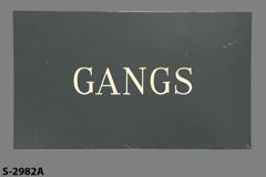 Sign-Gangs, grey/wht, plastic, 14"w x 8"t, stock number S-2982a