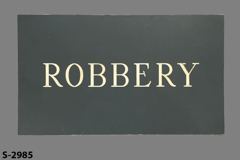 Sign-Robbery, grey/wht, plastic, 14"w x 8"t, stock number S-2985