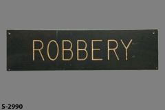 Sign-Robbery, blk/wht, 19"w x 5"t, stock number S-2990