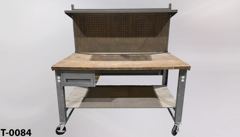 Table, metal frame, wood top, w/ pegboard back, metal top shelf, stock number T-0084