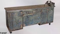 Table/cabinet, aged wood w/metal top, w/ 5'' vise, 2 drawers, 3, stock number T-0107