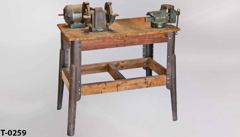Table, wood top metal frame, period, w/ belt driven grinder & vise, stock number T-0259