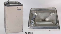 Water fountain, wall mount, white metal w/ steel top, 15"wx15"dx29"t, stock number W-0135